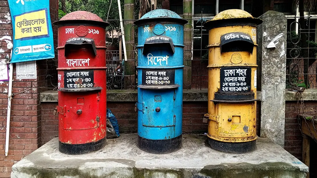 A row of post boxes outside a post office