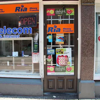 A money transfer shopfront with its sign above the window