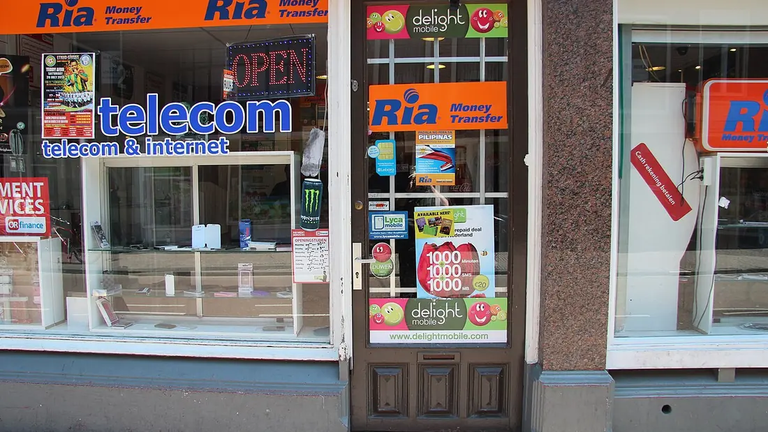 A money transfer shopfront with its sign above the window